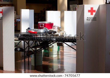 GARDEN CITY, NY - APRIL 3, 2011:  Setting up for the American Red Cross blood drive for disaster relief in Garden City, New York in Roosevelt Field Mall.