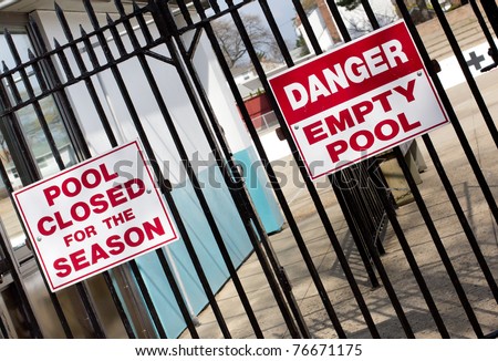 Signs warn of empty pool in the off season