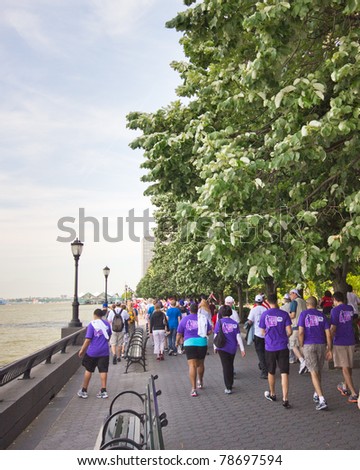 NEW YORK CITY - JUNE 5:  The American Liver Foundation holds a 3 mile walk Sunday June 5, 2011 to raise money.  Seen here, participants of the Liver Life Walk walk along the river in lower Manhattan, NY