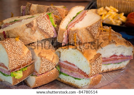 Slices of an Italian party sandwich on a platter