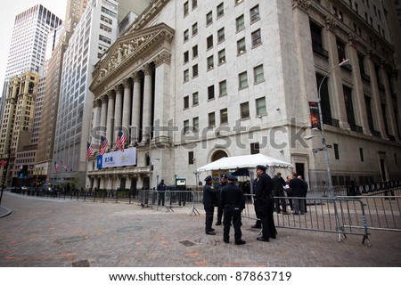 NEW YORK CITY - OCT. 21:  Police officers gather at barricade on Wall St. on October 21, 2011 in NYC.  The Financial District has been the epicenter of the Occupy Wall St. Protests since Sept 2011.