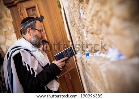 JERUSALEM - MAY 16: Orthodox Jewish man prays at western wall on May 16, 2011. The Western wall is an important Jewish religious site located in the Old City of Jerusalem