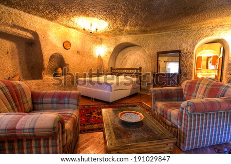 CAPPADOCIA, TURKEY - JUN 16: Cave bedroom on June 16, 2011 in Cappadocia, Turkey. The best historic mansions and cave houses for tourist stays are in Urgup, Goreme, Guzelyurt and Uchisar.