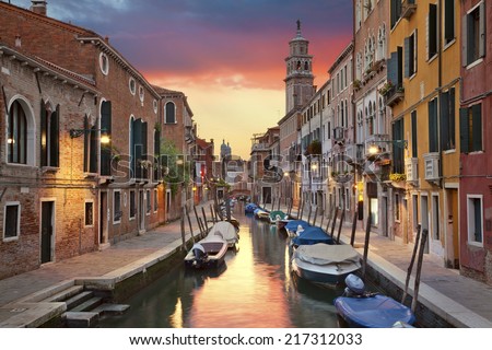 Venice. Image of one of many narrow canals in Venice during beautiful sunset.