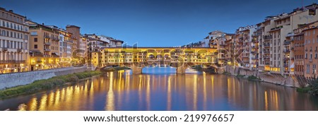 Florence. Panoramic image of historical center of Florence with Ponte Vecchio during twilight blue hour.