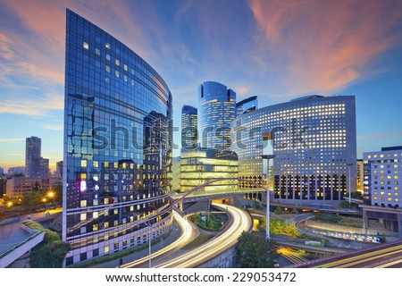 Paris. Image of office buildings in modern part of Paris during sunset.