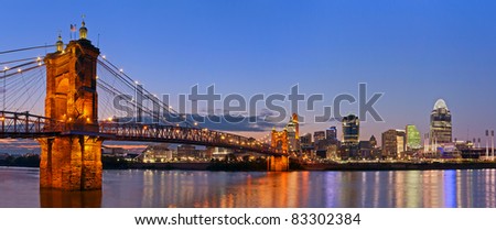 Cincinnati skyline panorama. Image of Cincinnati and John A. Roebling suspension bridge at twilight.