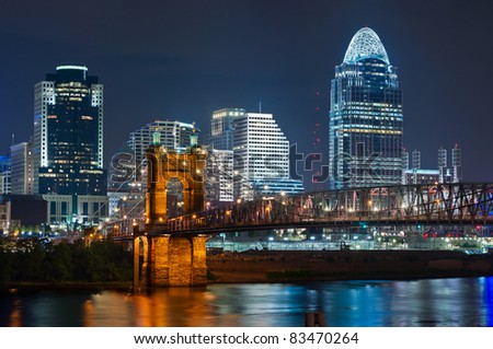 Cincinnati skyline. Image of Cincinnati and John A. Roebling suspension bridge at night.