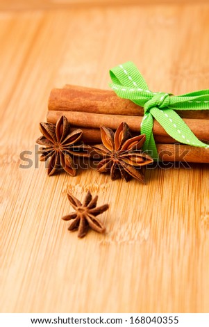 Cinnamon sticks and anise on wooden tabletop