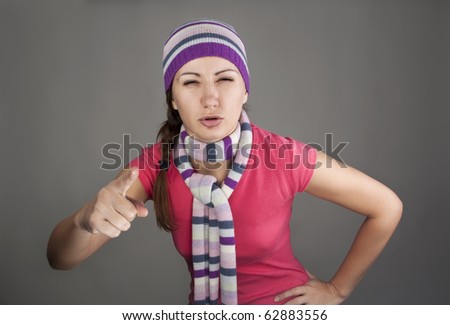 Portrait of an angry woman pointing at you