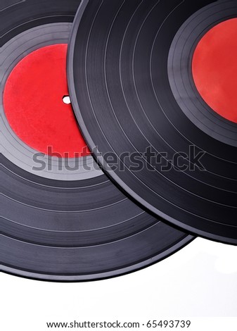 Two vintage vinyl records with red label, closeup