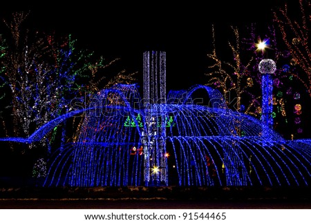 Night park, decorated by varicoloured illumination on occasion of holiday New Year