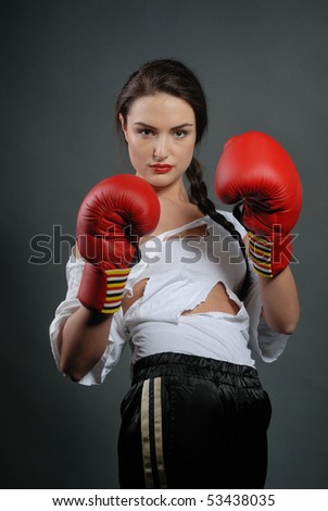 Young woman in boxing gloves