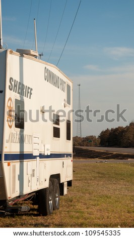 CREEK COUNTY, OKLAHOMA - AUGUST 6 2012: sheriff\'s command post in the intersection of highways 48 and 33 against wildfire burned background  on August 6, 2012 in rural Creek County, Oklahoma, USA