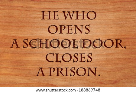 He who opens a school door, closes a prison - quote by Victor Hugo on wooden red oak background