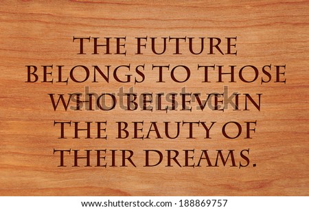 The future belongs to those who believe in the beauty of their dreams - quote by Eleanor Roosevelt on wooden red oak background