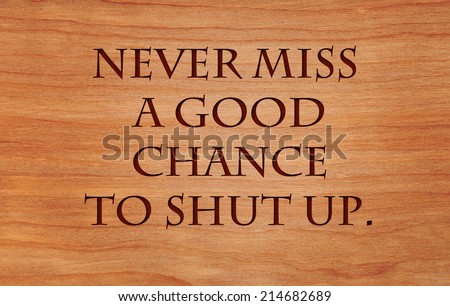 Never miss a good chance to shut up - an old saying on wooden red oak background