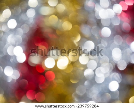 Shiny gold, silver and red bokeh background