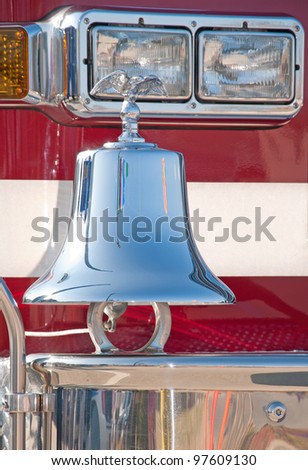 Traditional chrome bell on the front bumper of a firetruck