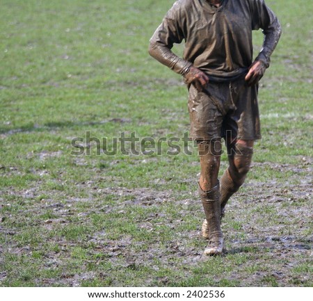muddy rugby union player