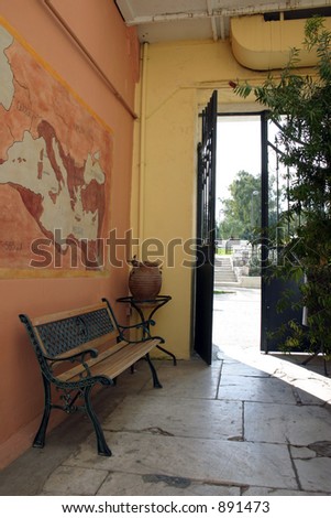 Interior garden in neoclassical villa. View at the gate.