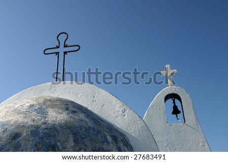 Christian chapel detail with two crosses on a dome and belfry