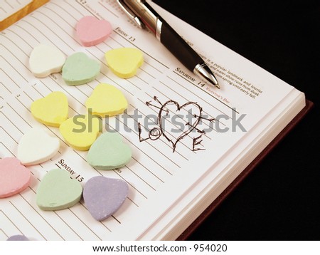 (close up) day planner with hearts and note..