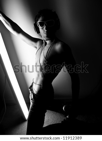 Something different. Male model holding one light posing (Lighting this way for effect)