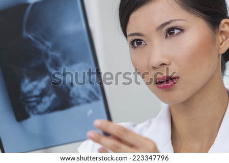 A Chinese Asian female medical doctor with head skull x-ray in a hospital