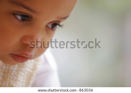 A beautiful mixed race girl in deep thought