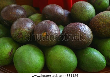 Avocados on display on a market stall