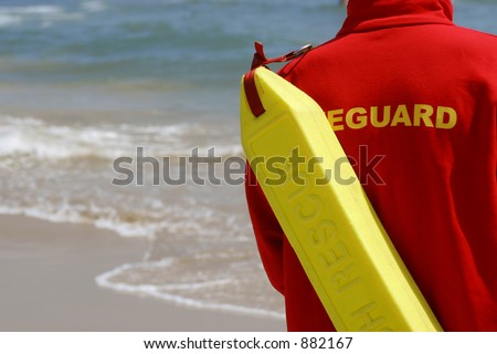 A lifeguard watching along a sandy beach