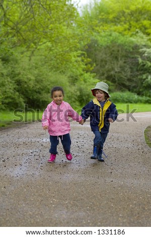 boy and girl holding hands coloring. stock photo : A little oy and