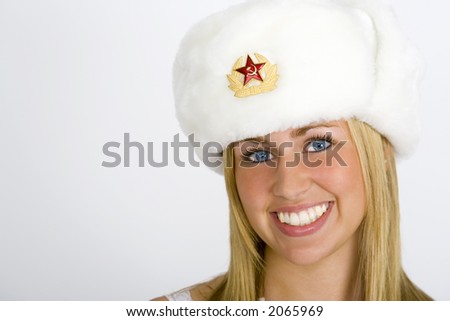 stock photo A beautiful young Russian girl smiling and wearing a fur hat
