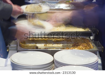 Motion blurred shot of food being served in a company canteen
