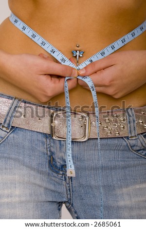  a pierced belly button measuring 