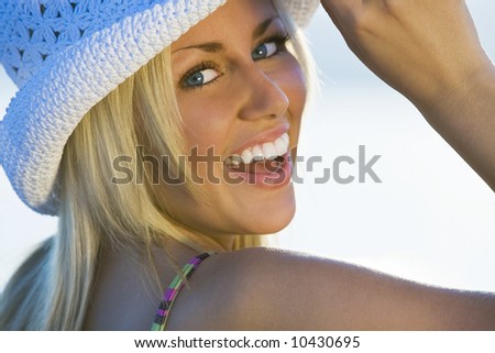 A beautiful young woman turning and laughing for the camera