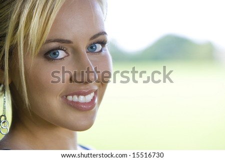 A beautiful blond haired blue eyed model shot in natural surroundings with copy space