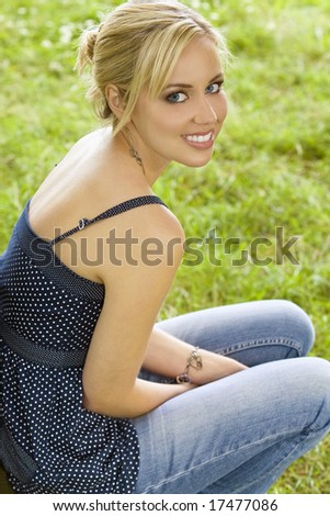 A beautiful blond haired blue eyed model shot in natural surroundings