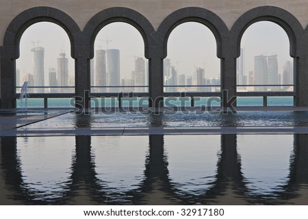 The Doha skyline shot through traditional arches from inside the Museum of Islamic Art, Qatar December 2008