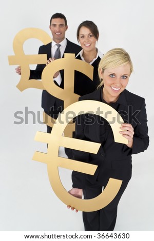 A team of three young executives, one man and two women, holding currency symbols and looking happy.