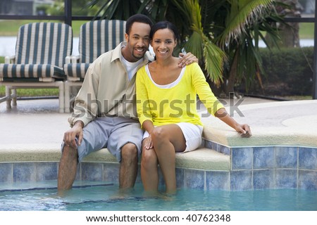 http://image.shutterstock.com/display_pic_with_logo/57715/57715,1258033407,2/stock-photo-a-happy-african-american-man-and-woman-couple-in-their-thirties-sitting-with-their-feet-in-a-40762348.jpg
