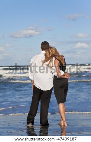 http://image.shutterstock.com/display_pic_with_logo/57715/57715,1267106957,7/stock-photo-a-young-man-and-woman-romantic-couple-in-love-arms-around-each-other-cuddling-on-a-beach-with-a-47439187.jpg