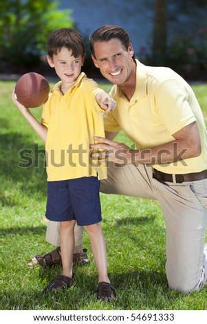 A father teaching his son how to play American football outside in sunshine