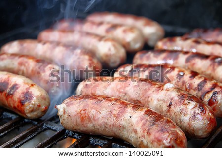 Bratwurst sausages on grill.