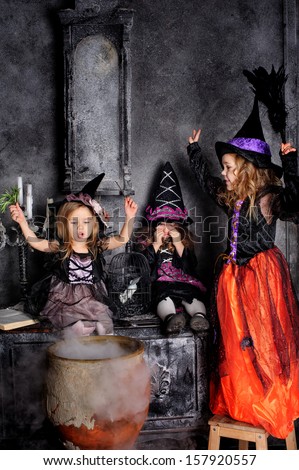 group of three Little Halloween Witch with poison, pot and magic smoke