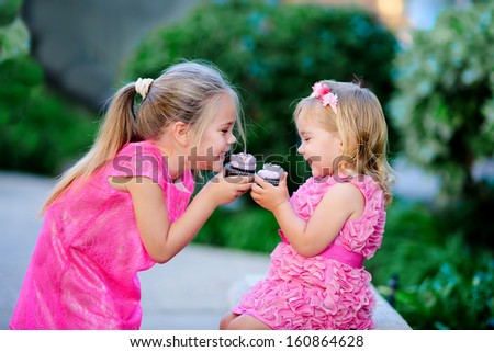 Group Of Two Children Cute Fashion Little Girls Eat Happy Birthday Pink Cupcake