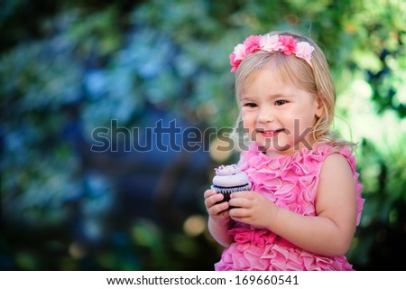 cute fashion little girl eat happy birthday pink cupcake