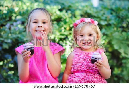 Group Of Two Children Cute Fashion Little Girls Eat Happy Birthday Pink Cupcake