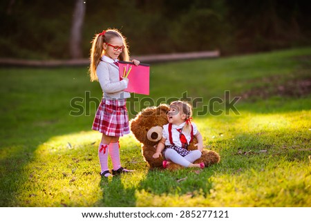 two kids preschooler and kindergarten, back to school outdoor